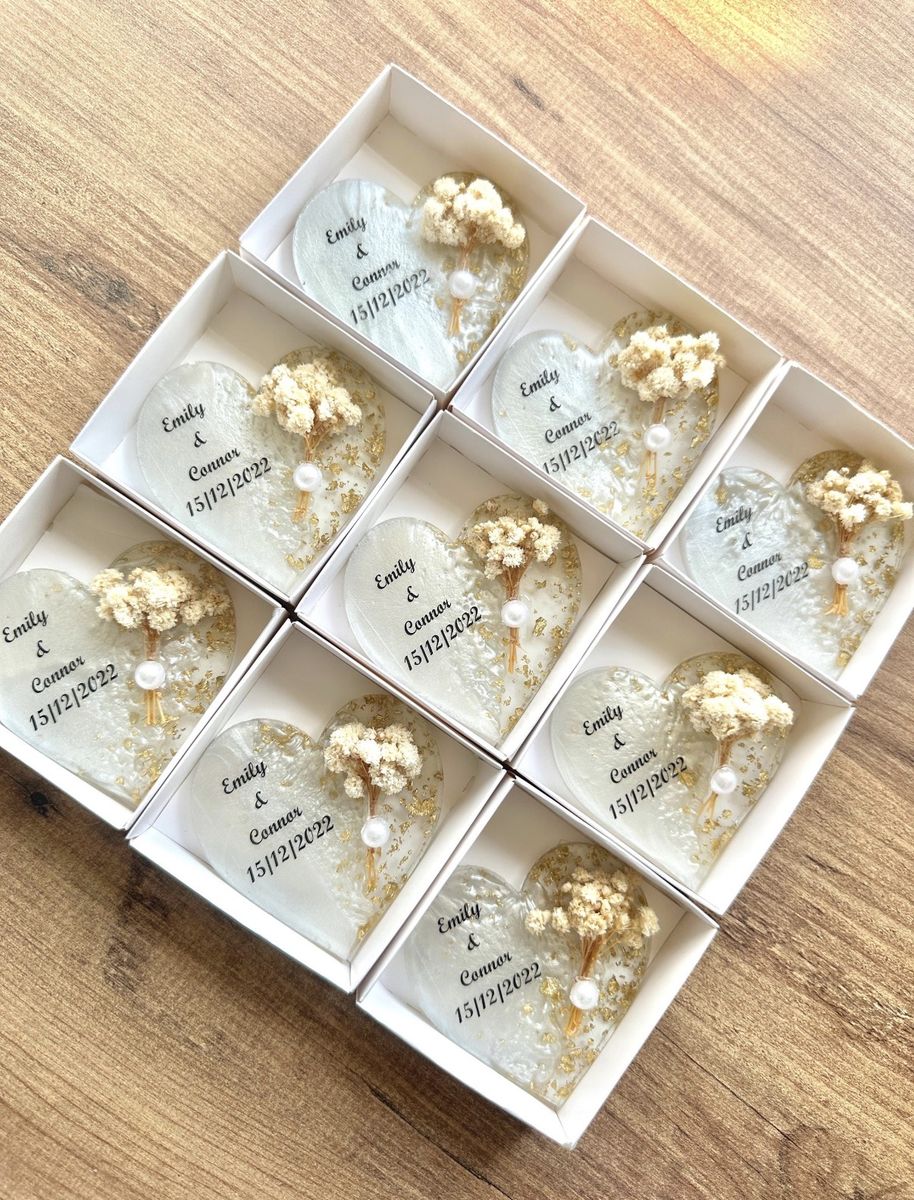 Resin heart coasters set with dried gypsophila and gold leaf, each named Emily & Connor, boxed individually in white